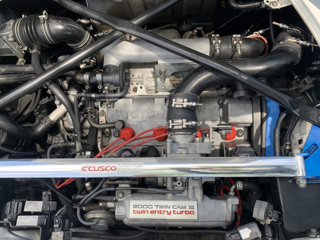 An engine bay in a car after being dry ice blast detailed.