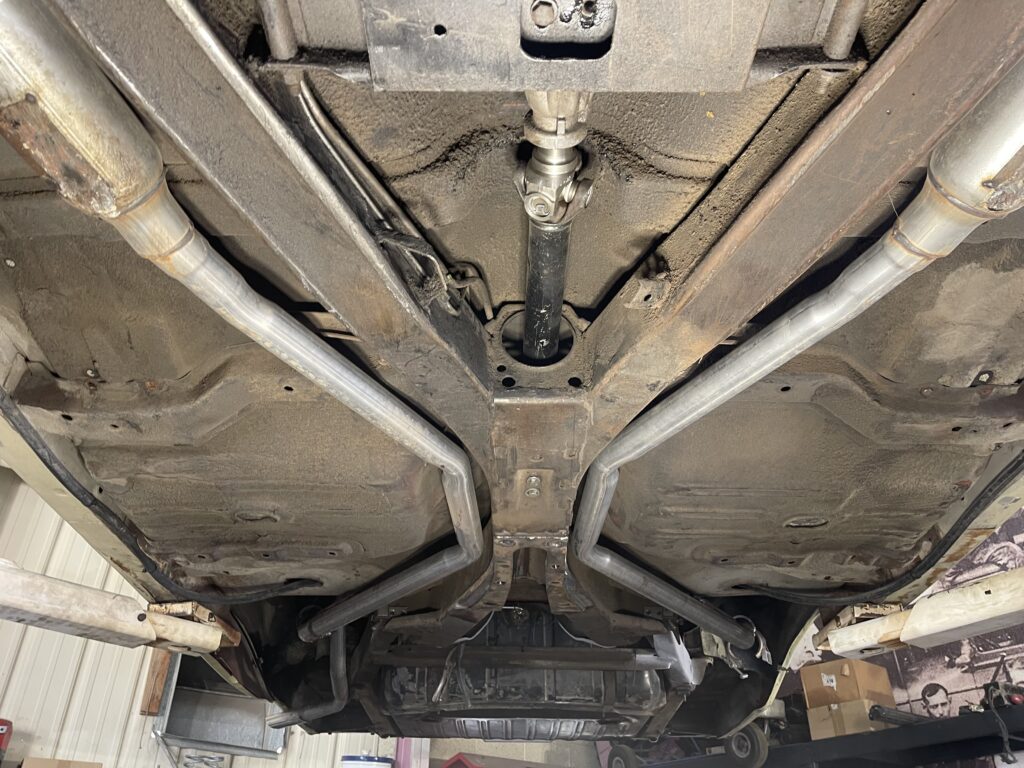 An image of the extremely dirty and grimy undercarriage of a truck before being blasted with dry ice.